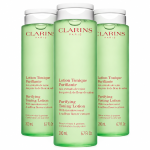 Three identical bottles of 3x Clarins Purifying Toning Face Lotion 200ml, pale green with white flip-top caps and French and English labels.