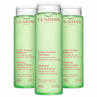 Three identical bottles of 3x Clarins Purifying Toning Face Lotion 200ml, pale green with white flip-top caps and French and English labels.