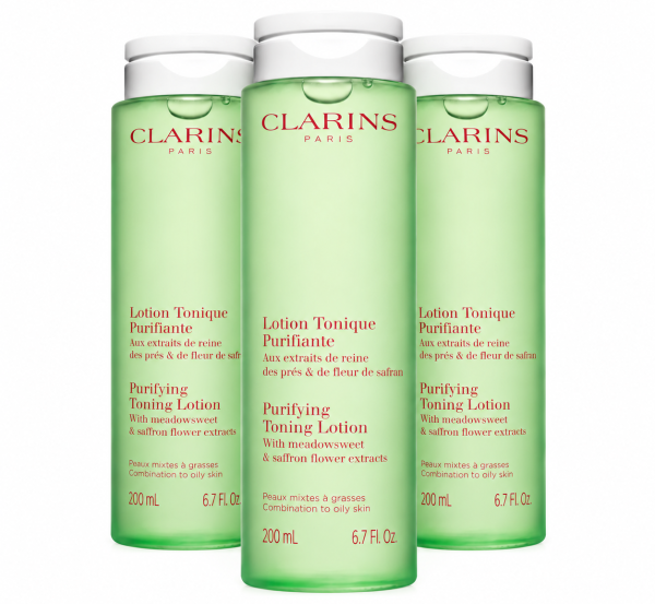 Three identical bottles of 3x Clarins Purifying Toning Face Lotion 200ml, pale green with white flip-top caps and French and English labels.