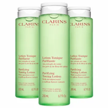 Three identical bottles of 3x Clarins Purifying Toning Face Lotion 200ml, pale green with white flip-top caps and French and English labels.