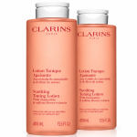 Two bottles of pink 3x Clarins Soothing Toning Face Lotion 400ml for very dry or sensitive skin, each with a white flip-top cap.
