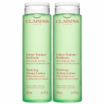 Two identical 200ml bottles of green 3x Clarins Purifying Toning Face Lotion.
