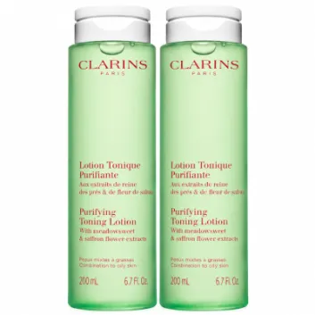 Two identical 200ml bottles of green 3x Clarins Purifying Toning Face Lotion.