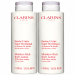 Two identical 400ml bottles of Clarins Moisture-Rich Shea Butter Body Lotion with white screw-top caps.